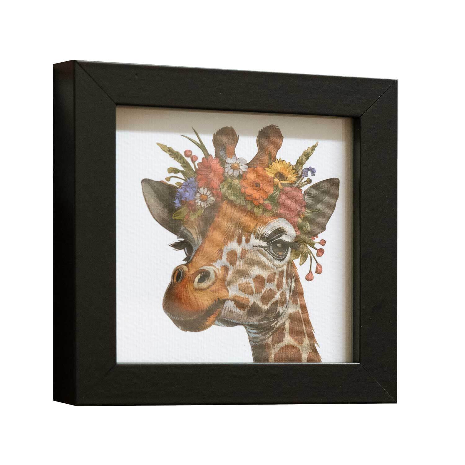 Cute giraffe art print with floral crown in a black frame, 10 x 10 cm, perfect for enhancing home decor.