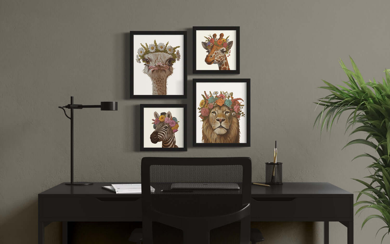 Stylish office setup featuring framed animal art prints with floral crowns on a desk.