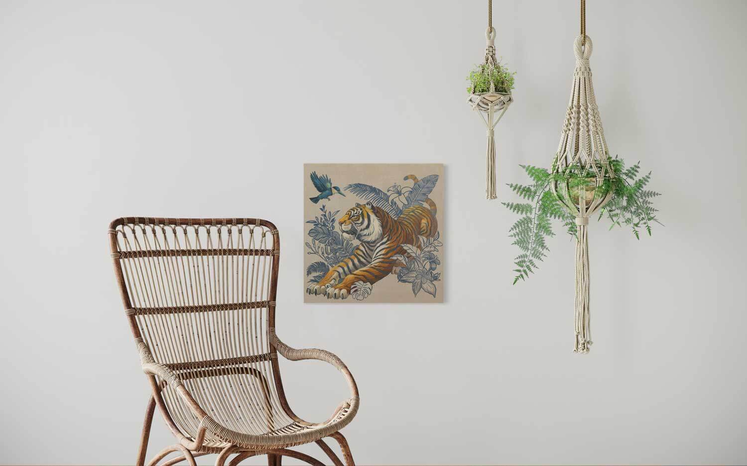 Sumatra hand-painted tiger illustration on canvas in a stylish, modern room with a rattan chair and hanging plants.
